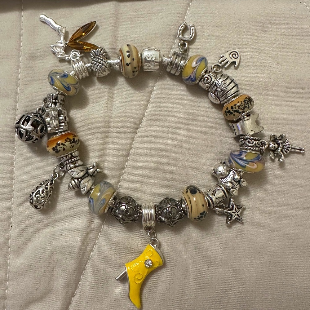 Handmade – NWOT – 925 silver plated charm bracelet. Yellow beads, variety charms